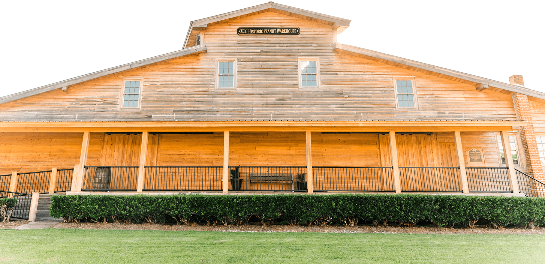 Large wooden building with a long porch